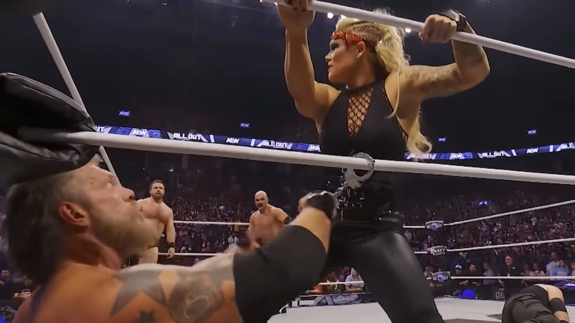 FTR about to attack Beth Copeland [Image Credits: All Elite Wrestling on YouTube]