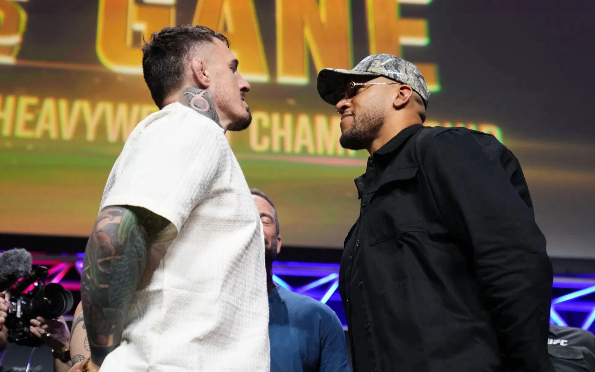 Tom Aspinall (left) talks about Ciryl Gane (right). [Image courtesy: Getty]
