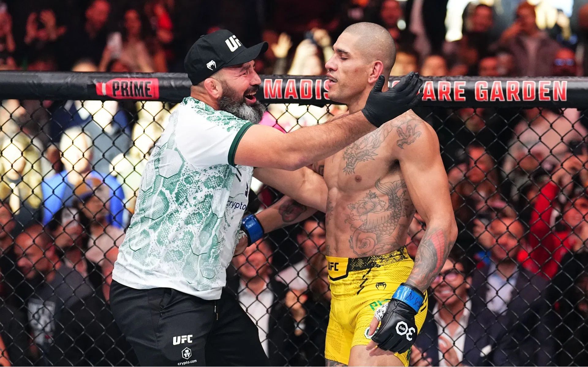 Alex Pereira (right) celebrates with Glover Teixeira (left). [Image courtesy: Getty]