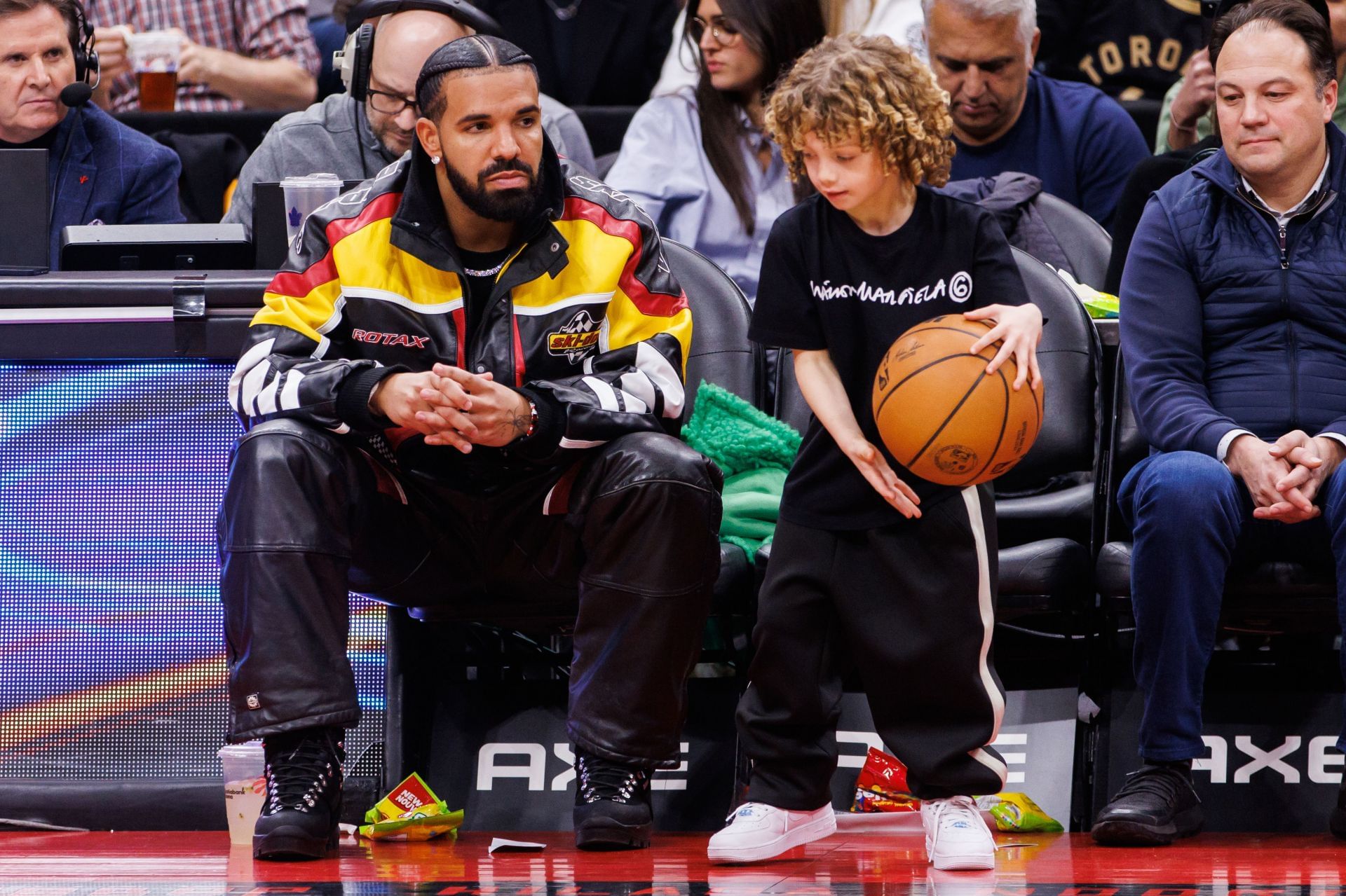 Rapper Drake plays with his son Adonis during the second half of the NBA game between the Toronto Raptors and the LA Clippers at Scotiabank Arena on December 27, 2022, in Toronto, Canada. (Photo by Cole Burston/Getty Images)