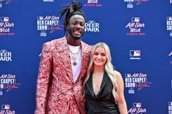 Elly De La Cruz’s girlfriend Raye Webb goes full love mode, rocking a custom outfit and layered necklaces honoring the Reds star
