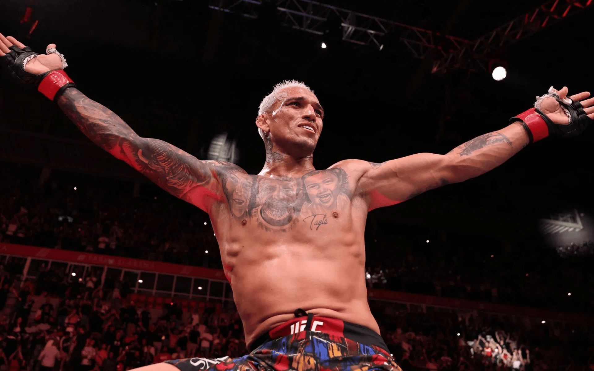 Charles Oliveira celebrates a victory in Argentina. [Image courtesy: Getty]
