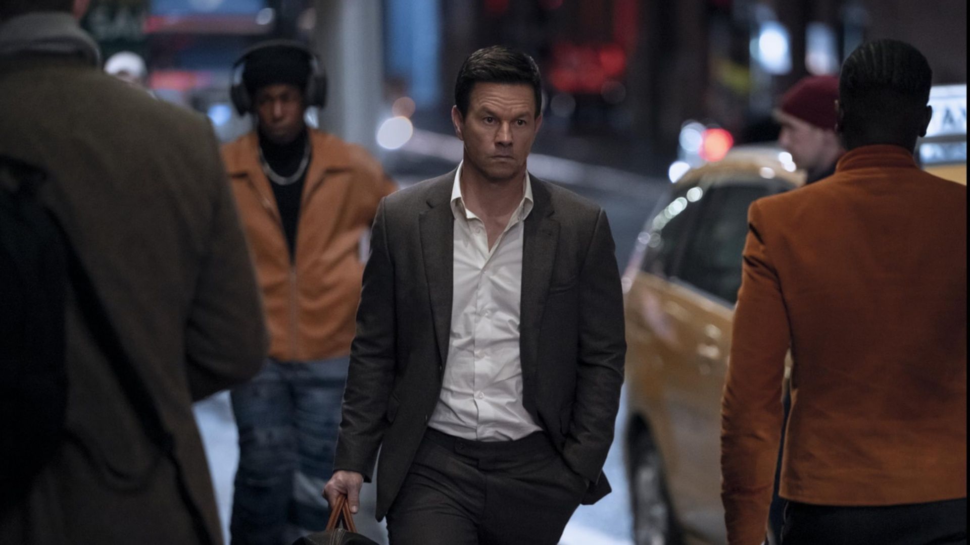 Mark Wahlberg walking through a busy street scene in Play Dirty, filmed in Sydney to stand in for New York City.