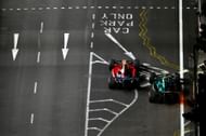 Lewis Hamilton and Fernando Alonso on track during practice - Singapore Grand Prix - Source: Getty