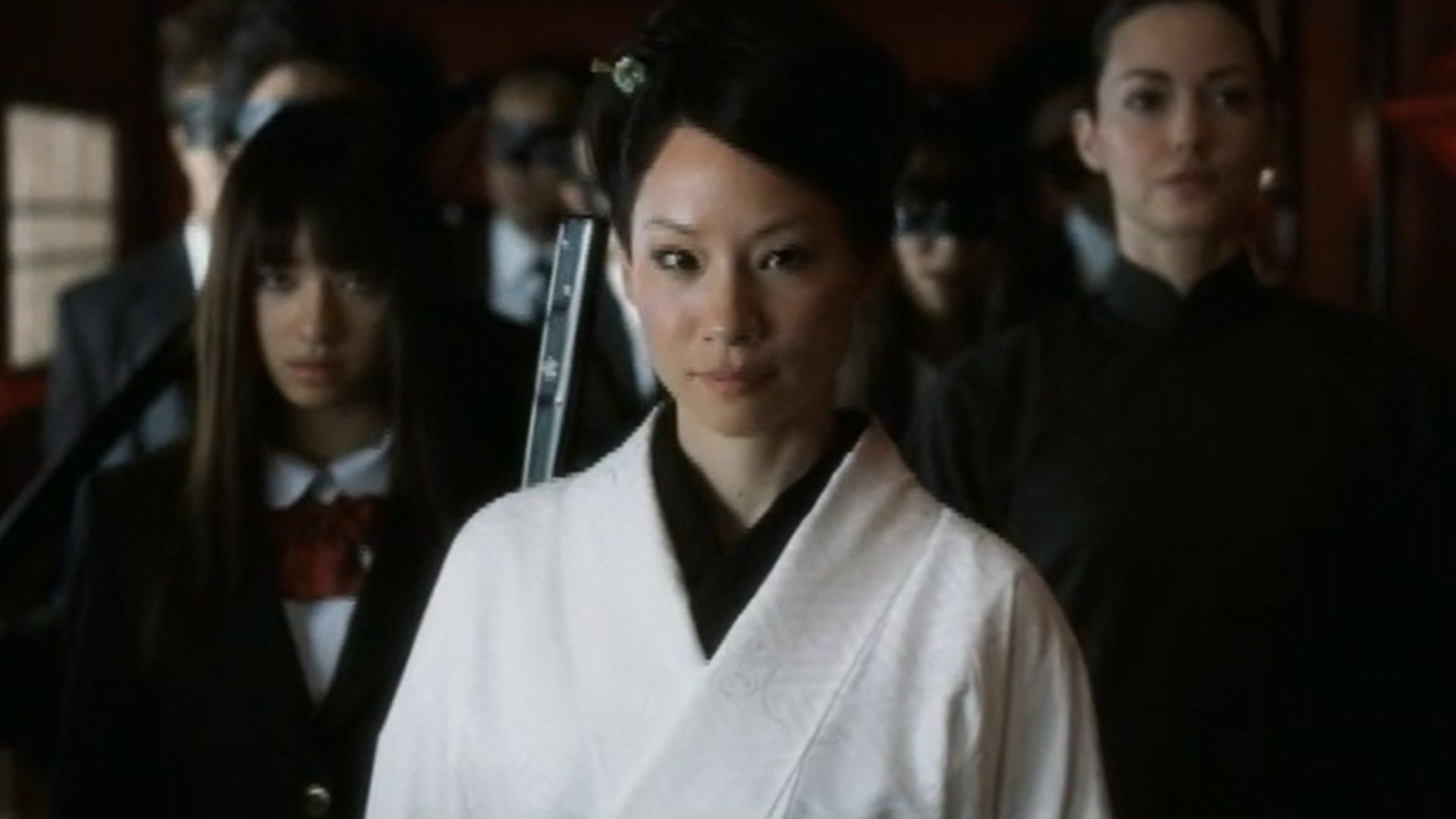 Kill Bill: The Whole Body Affairs &mdash; O-Ren Ishii stands with her entourage in a corridor scene. (Image via A Band Apart)