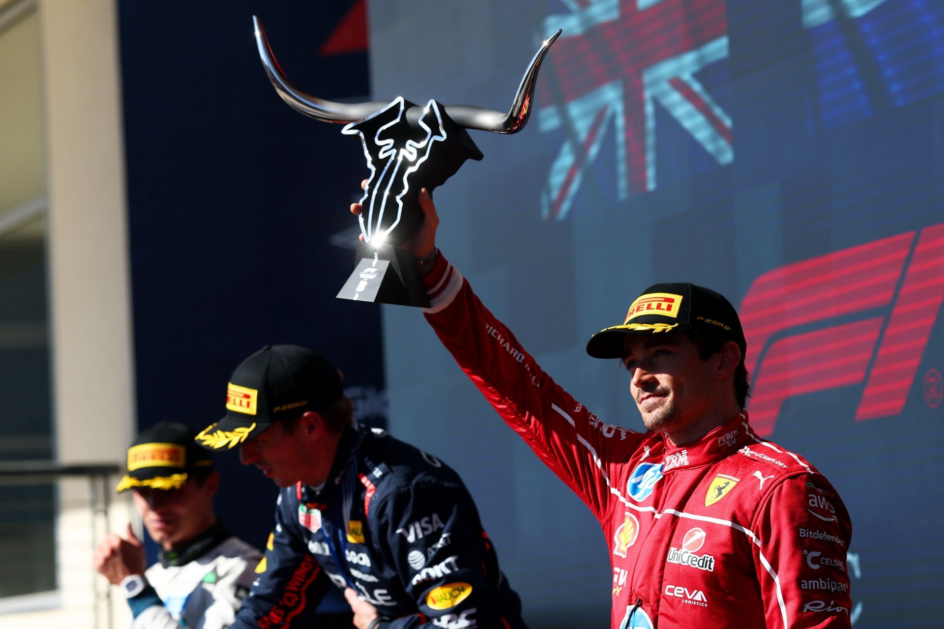 Third placed Charles Leclerc of Monaco and Scuderia Ferrari lifts his trophy on the podium during the F1 Grand Prix of United States at Circuit of The Americas - Source: Getty