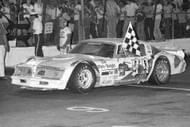 Dick Trickle (99) celebrates the 1978 Bluegrass 300 (ASA) late model race at Fairgrounds. Source: Getty