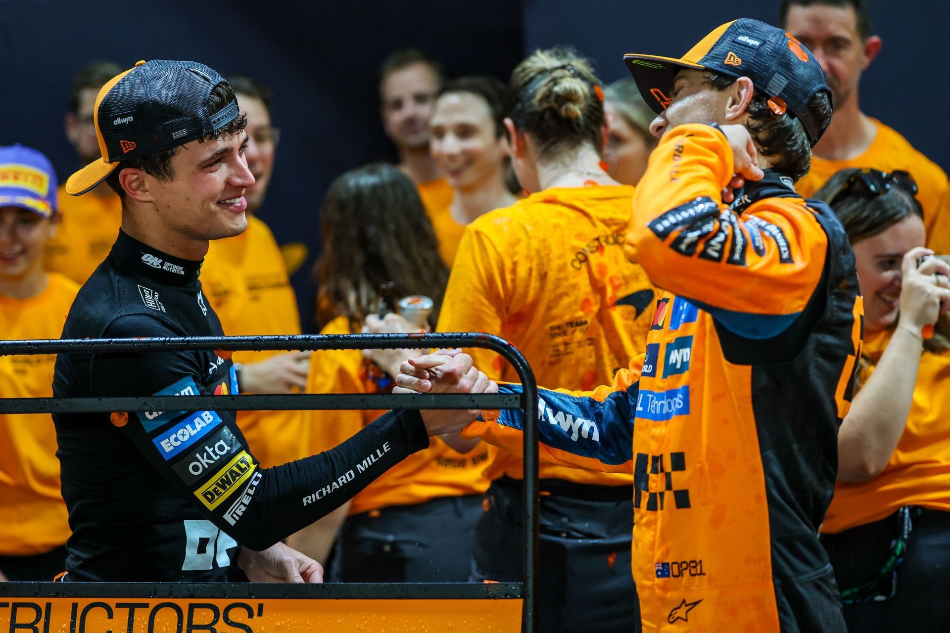 Lando Norris (L) and Oscar Piastri (R) celebrating McLaren&#039;s constructors&#039; championship victory after the 2025 F1 Grand Prix of Singapore - Source: Getty