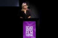 Tanya Simon speaking at the 26th SCAD Savannah Film Festival (Image via Getty)