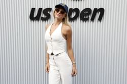 Olivia Dunne poses in white halter neck dress as she enjoys Sicilian vacation amid career duties