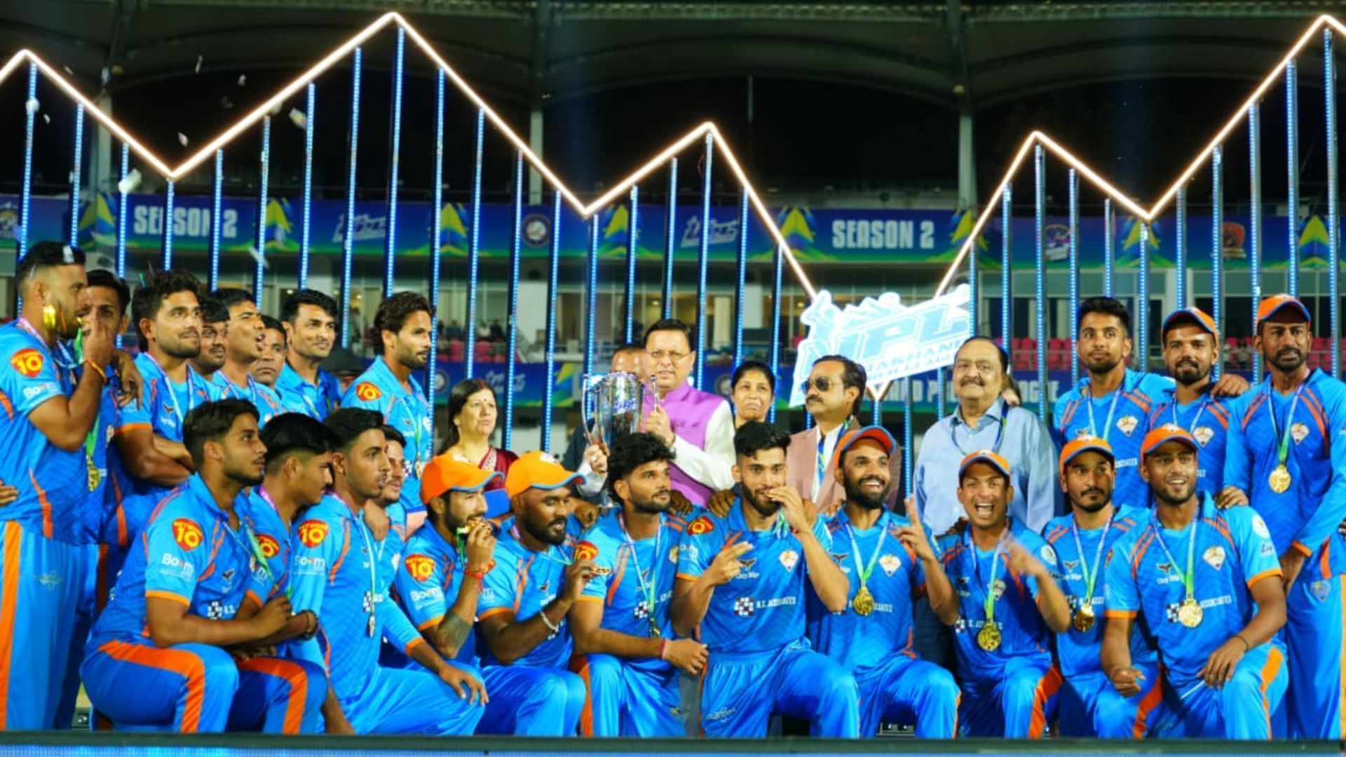Pushkar Singh Dhami with the Uttarakhand Premier League 2025 trophy and winning team (Image Credits: Pushkar Singh Dhami/X)