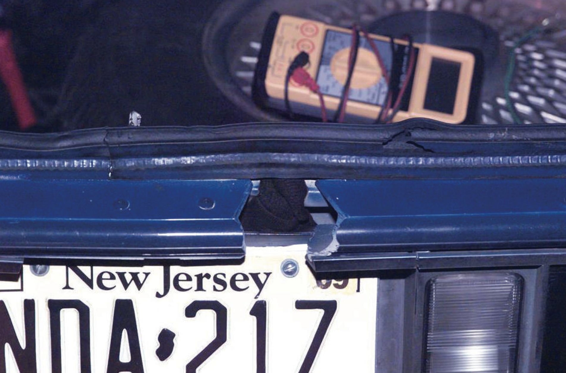 A hole was cut at the rear of the blue 1990 Chevrolet Caprice driven by Muhammad and Malvo, as a firing port to be used during their attacks. (Image via Wikimedia Commons)