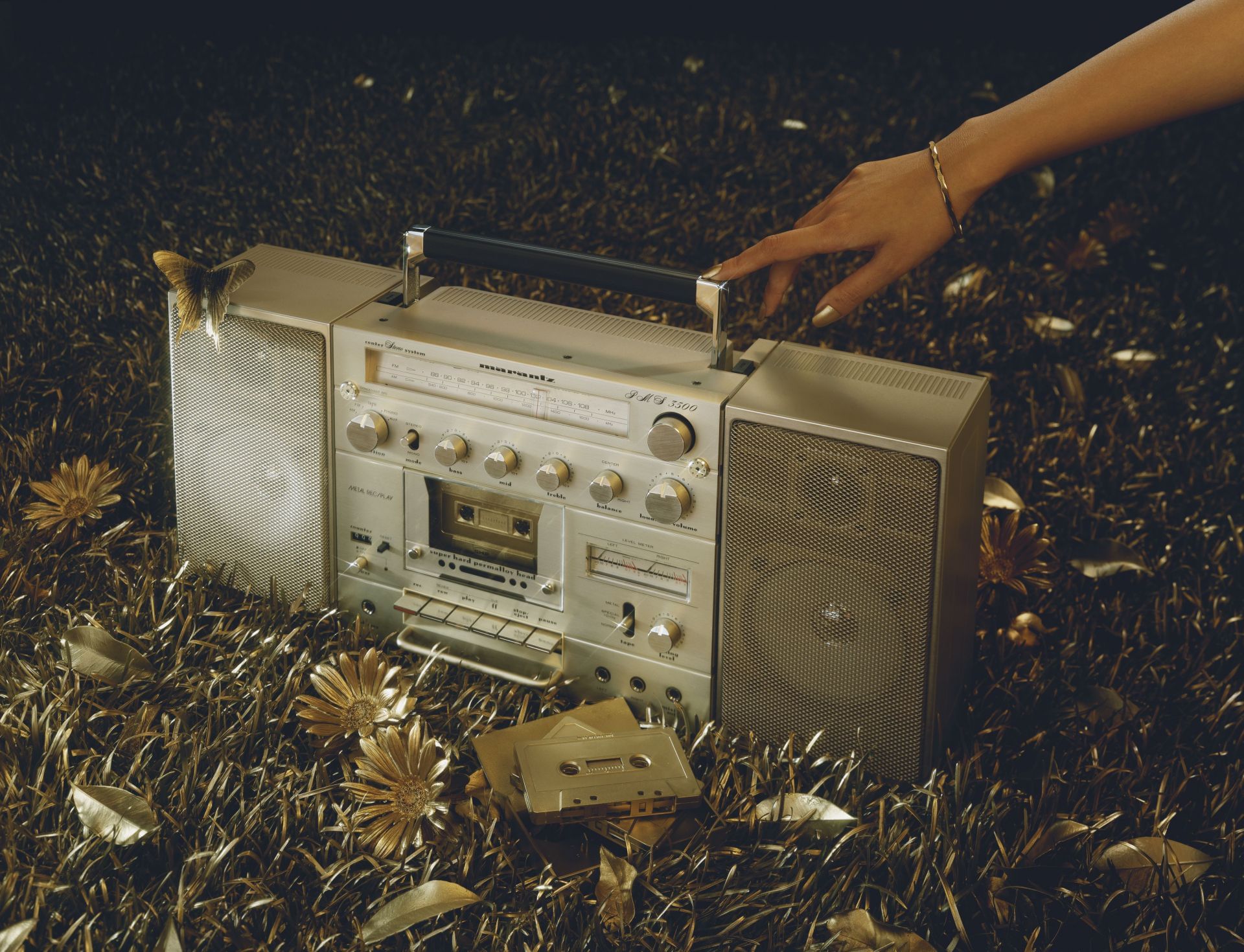 Woman hand touching boom box - Source: Getty