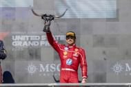 Charles Leclerc holds his third-place trophy on the 2025 F1 United States Grand Prix podium - Source: Getty