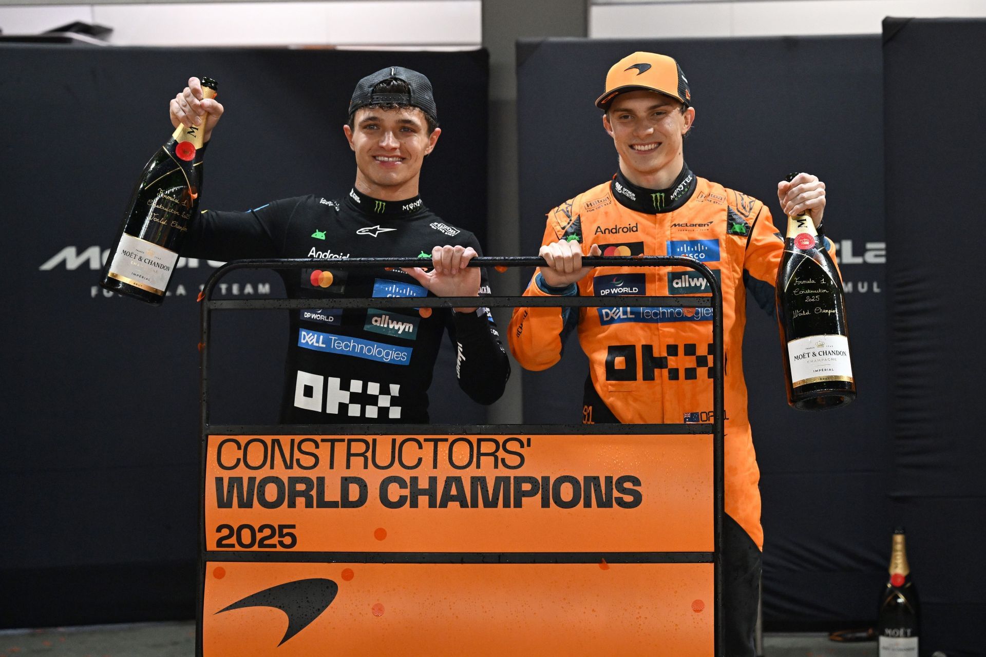 McLaren&#039;s Lando Norris (L) and Oscar Piastri (R) celebrate after their team won the 2025 constructors&#039; world championship at the 2025 F1 Grand Prix of Singapore - Source: Getty