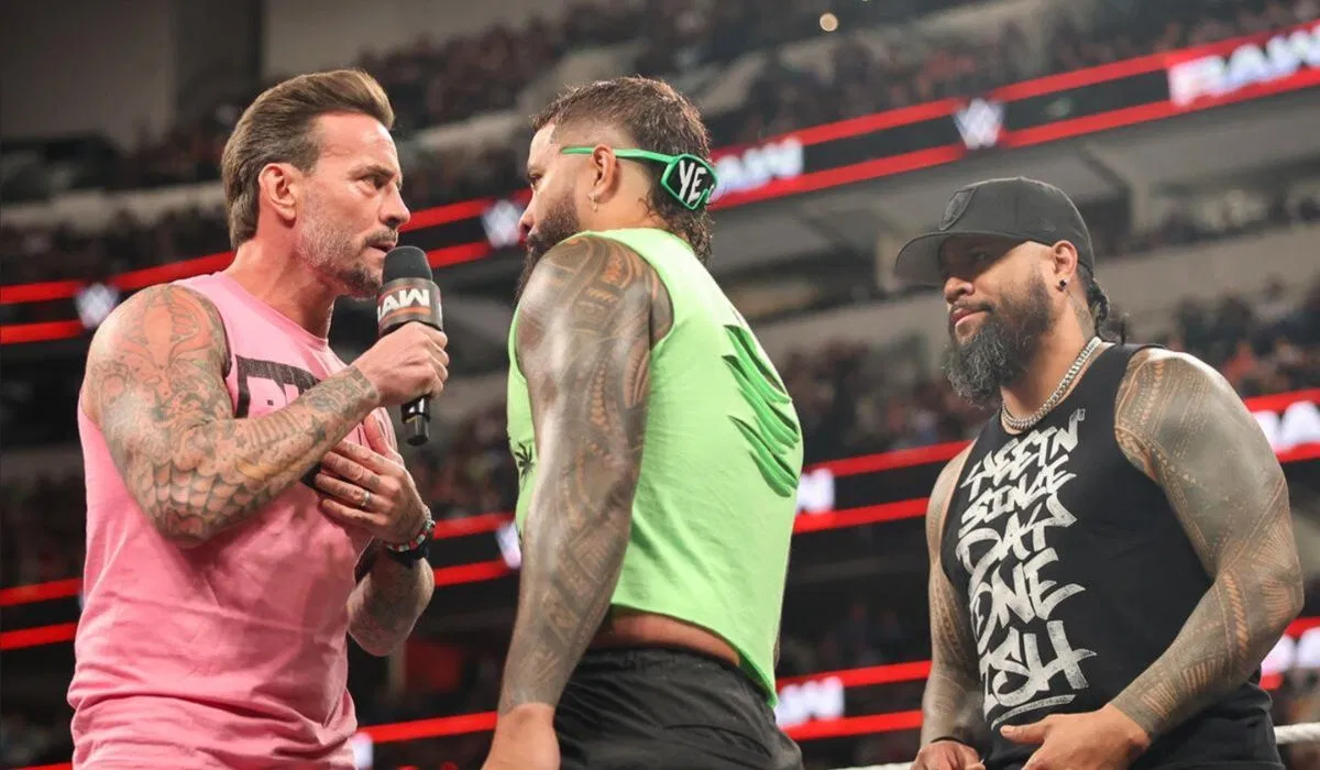 CM Punk and OG Bloodline members, The Usos. (Image via WWE.com)