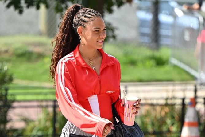 Trinity Rodman poses in 'DIY' outfit featuring red jacket and denim