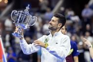 Novak Djokovic with the US Open 2023 trophy - Source: Getty