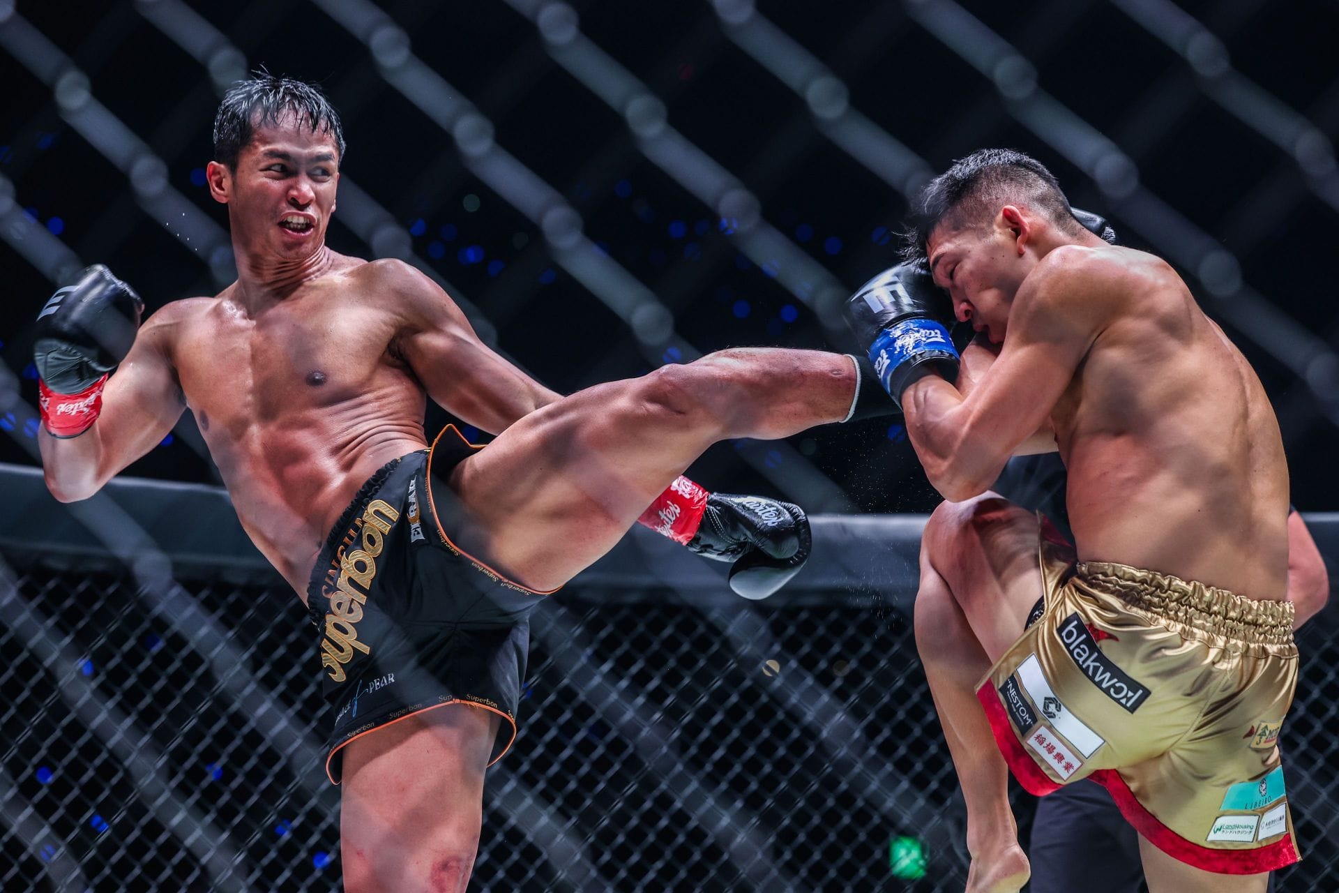 (From left) Superbon and Masaaki Noiri in action at last week