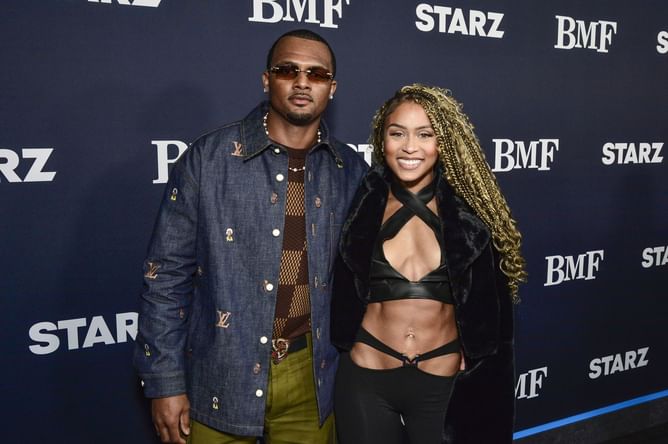 Deshaun Watson's wife Jilly Anais catwalks in flared halter-neck dress with tall brown boots 6 months after turning heads at SI Swimsuit Runway Show