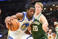 October 30, 2025; Milwaukee, Wisconsin, USA; Golden State Warriors forward Jonathan Kuminga (1) drives back to the basket, not Milwaukee Bucks guard AJ Green (20) in the second quarter at Fiserv Forum. Mandatory Credit: Benny Sieu-Image Images - Source: Image