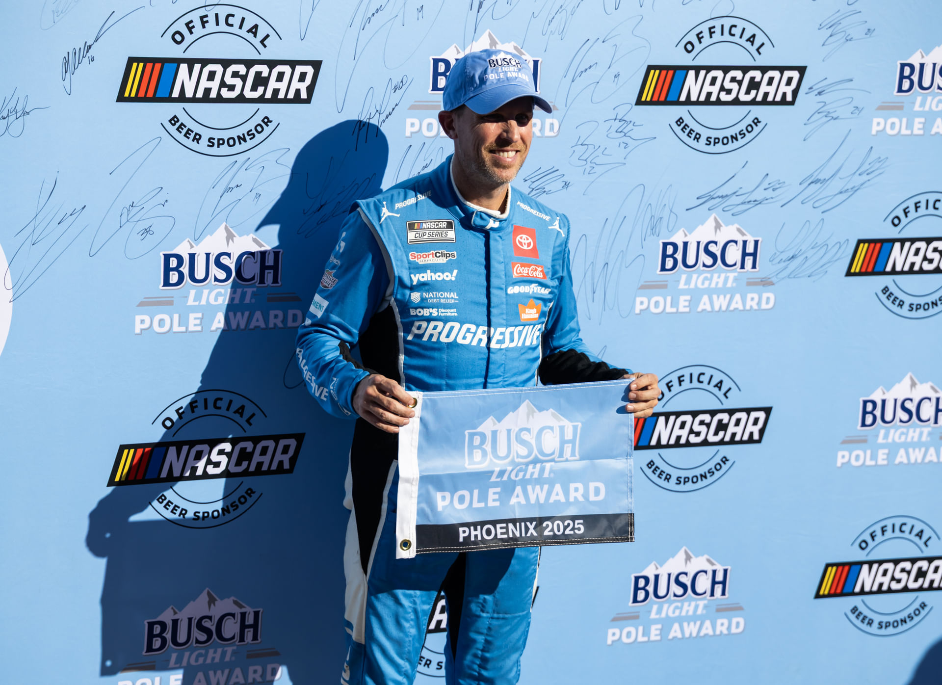 Denny Hamlin (11) poses for photos after winning the pole position during qualifying for the NASCAR Championship race at Phoenix Raceway - Source: Imagn