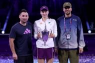Elena Rybakina and coach Stefano Vukov with the WTA Finals trophy - Source: Getty