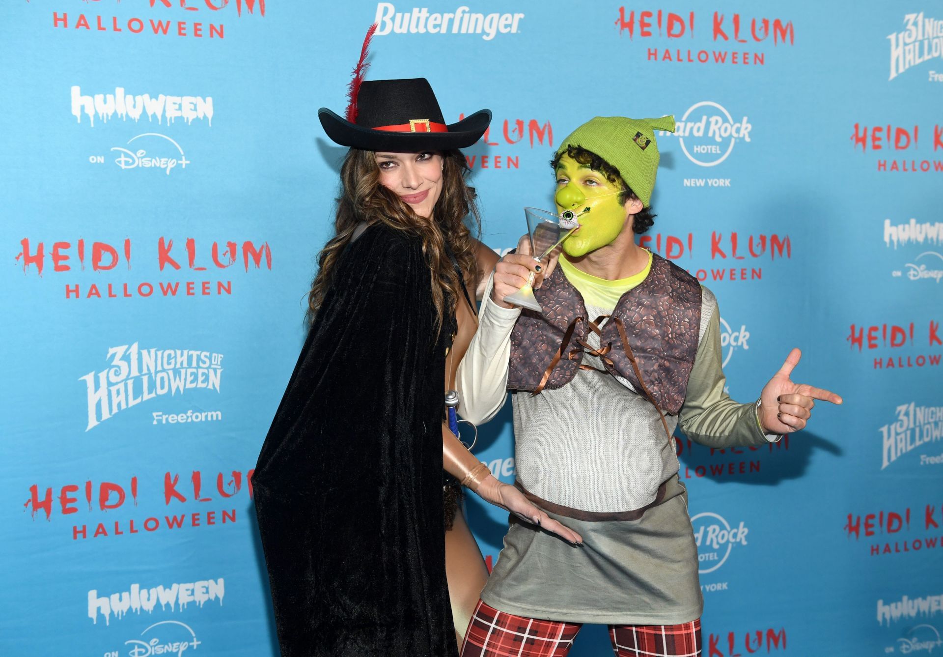 Mia Swier and Darren Criss attend Heidi Klum's 24th Annual Halloween Party as Shrek and Puss in Boots (Image via Getty)