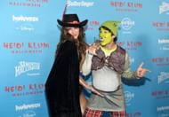 Mia Swier and Darren Criss attend Heidi Klum's 24th Annual Halloween Party as Shrek and Puss in Boots (Image via Getty)