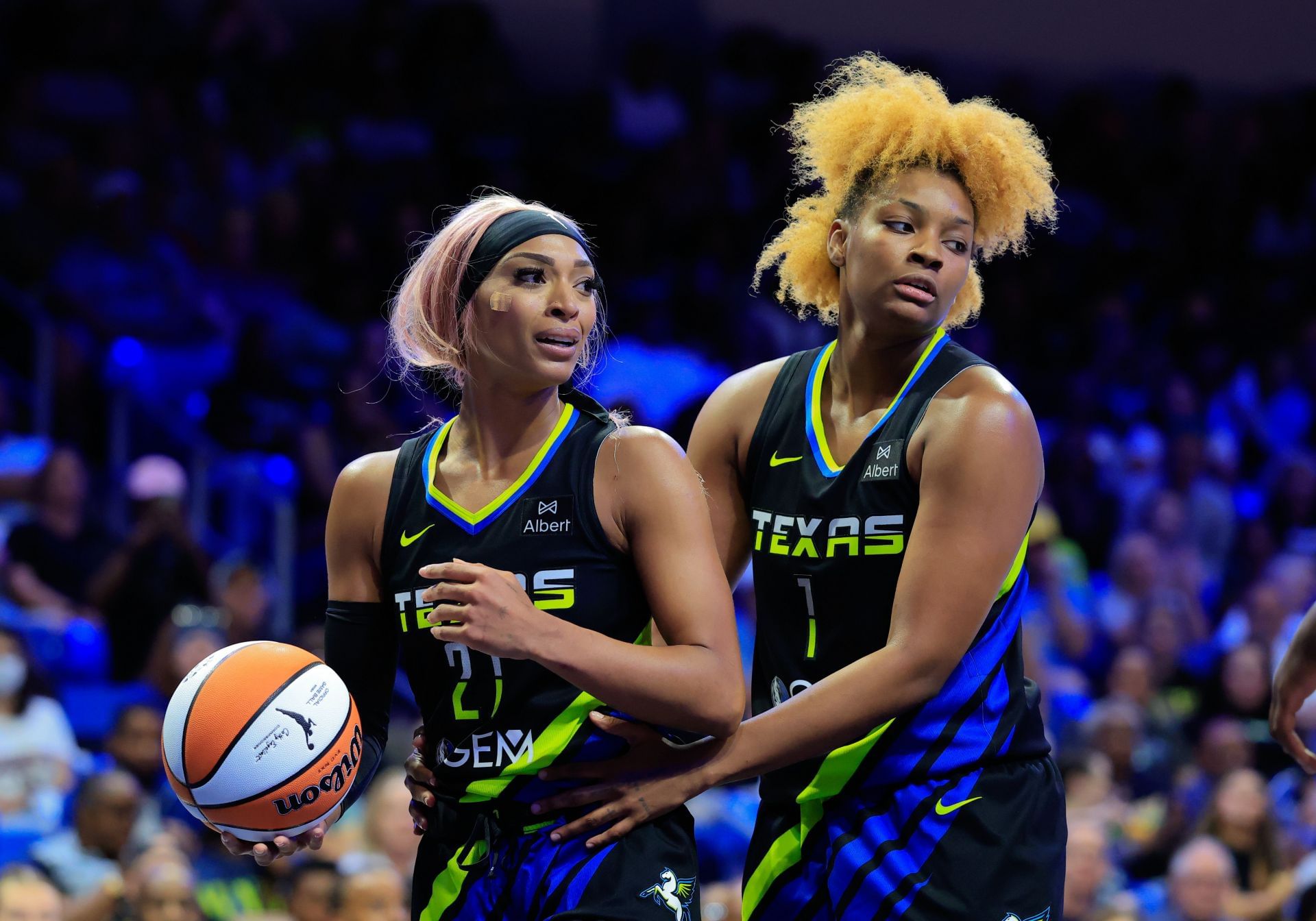 DiJonai Carrington and NaLyssa Smith with the Dallas Wings.