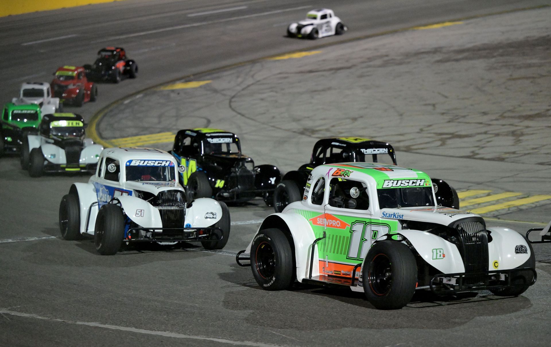 Brexton Busch (18) leads his father, Kyle Busch (51), in the Midgets race at The Bullring. Source: Getty