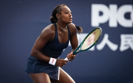 PICTURE: Alycia Parks poses in a black bikini as she enjoys refreshing drink during scenic tropical getaway
