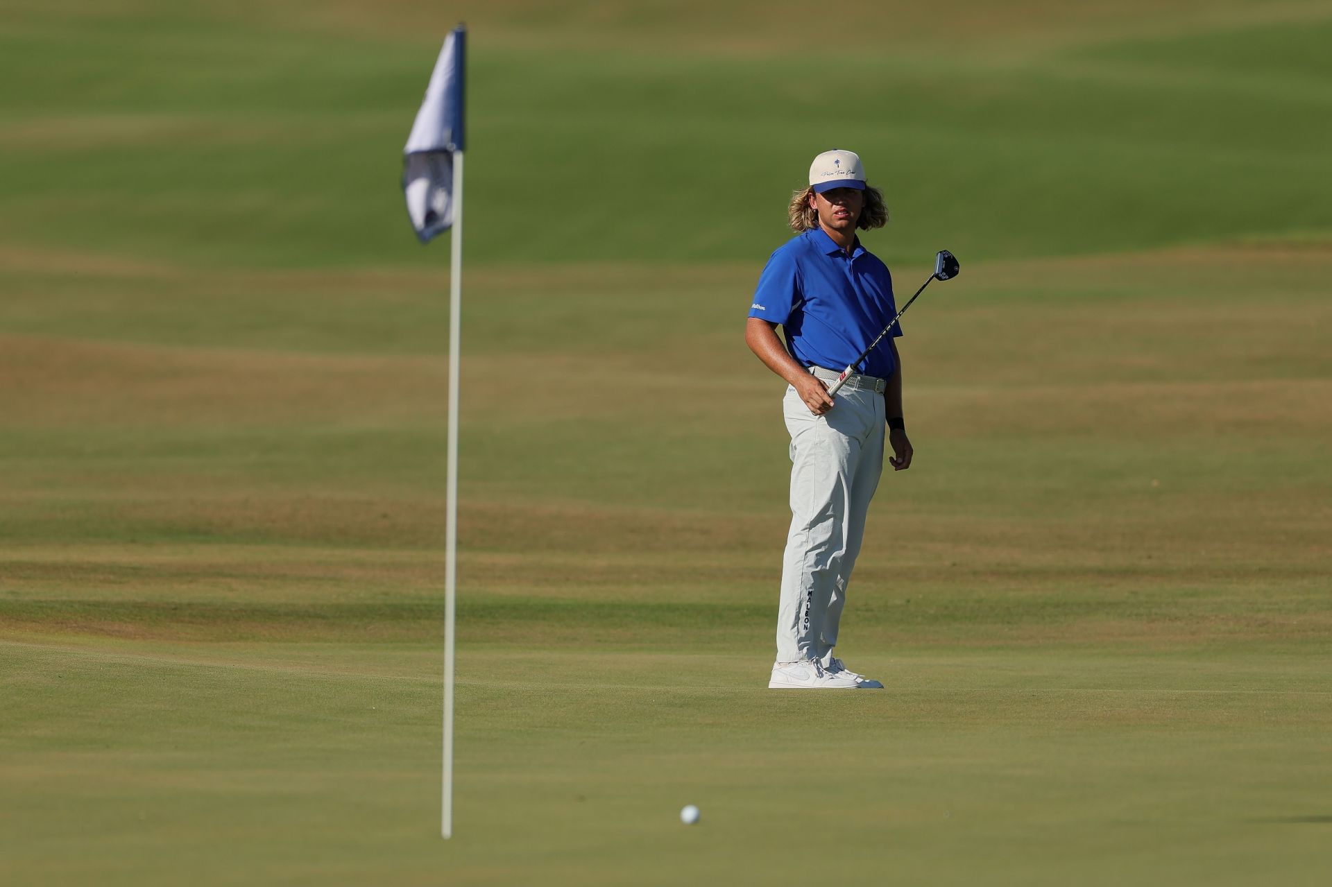 Garrick Higgo putts on the 18th hole during the third round of the World Wide Technology Championship 2025 (Image Source: Getty)