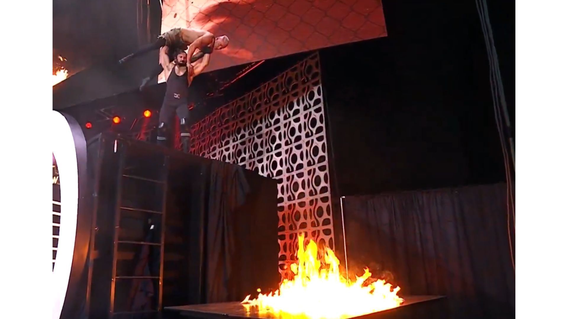 Pac about to throw Darby Allin on to a flaming table [Image Credits : All Elite Wrestling on X]