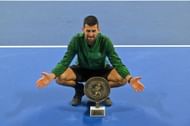 Novak Djokovic strikes a pose with the men's singles trophy at the 2025 Hellenic Championship in Athens, Greece (Source: Getty)
