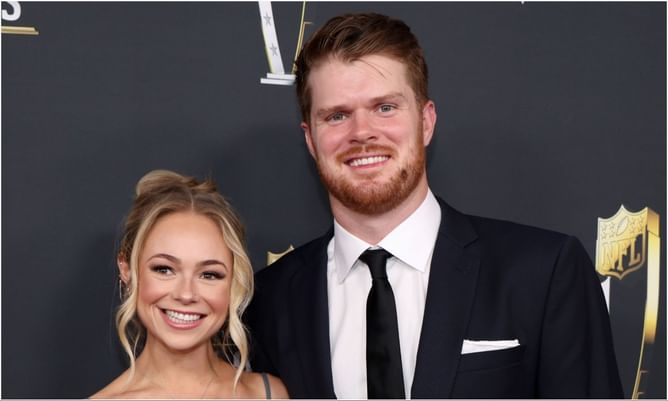Sam Darnold's fiancée Katie locks lips with Seahawks QB while rocking denim jacket and cowboy boots at Nissan Stadium, Tennessee