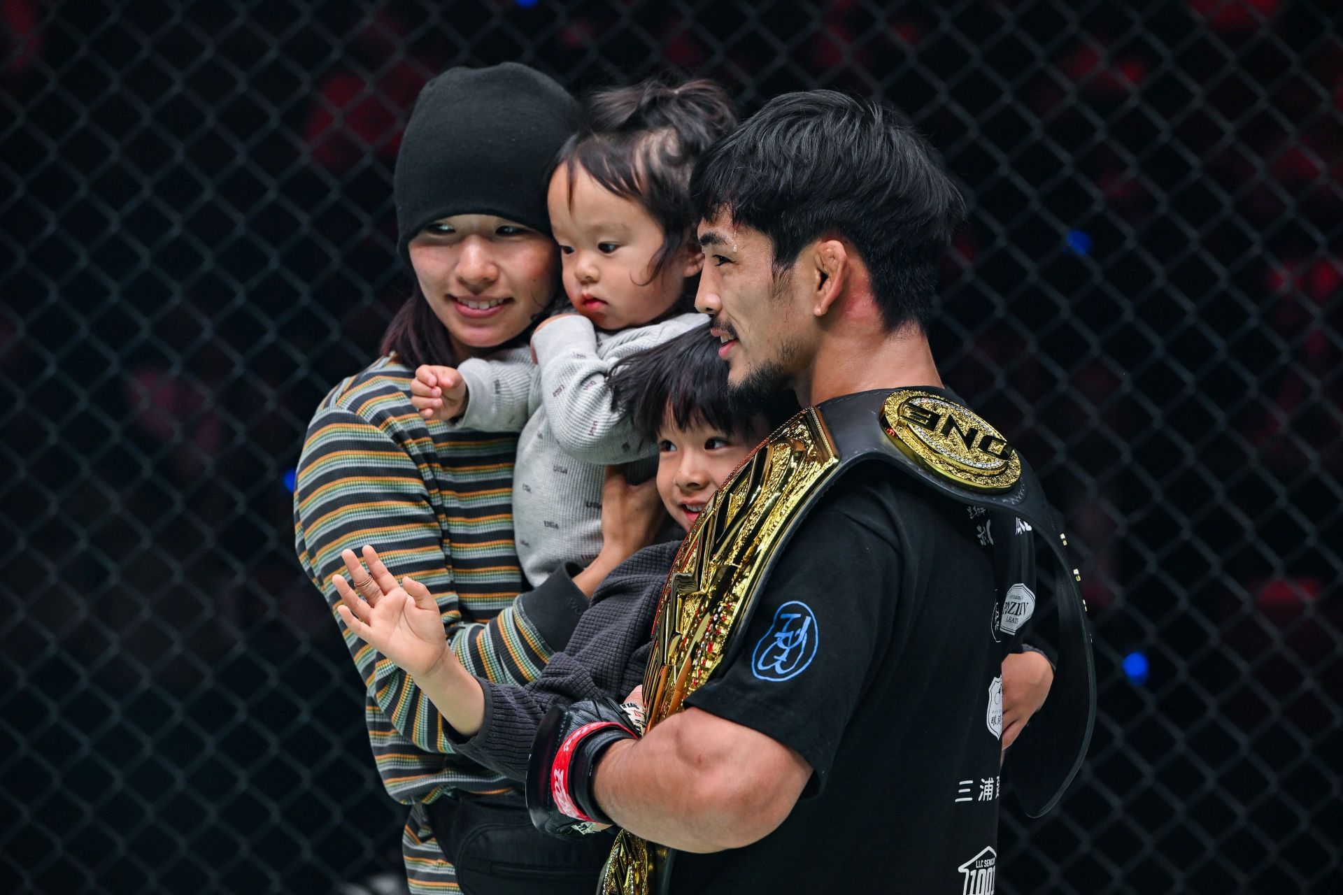 Yuya Wakamatsu (right) celebrates his first world title defense alongside his loving family. [Image: ONE Championship]