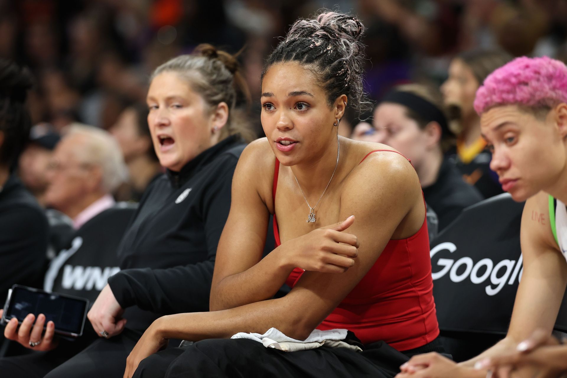 Napheesa Collier #24 of the Minnesota Lynx watches from the bench - Source: Getty Kelsey Plum #10 of the Los Angeles Sparks - Source: Getty