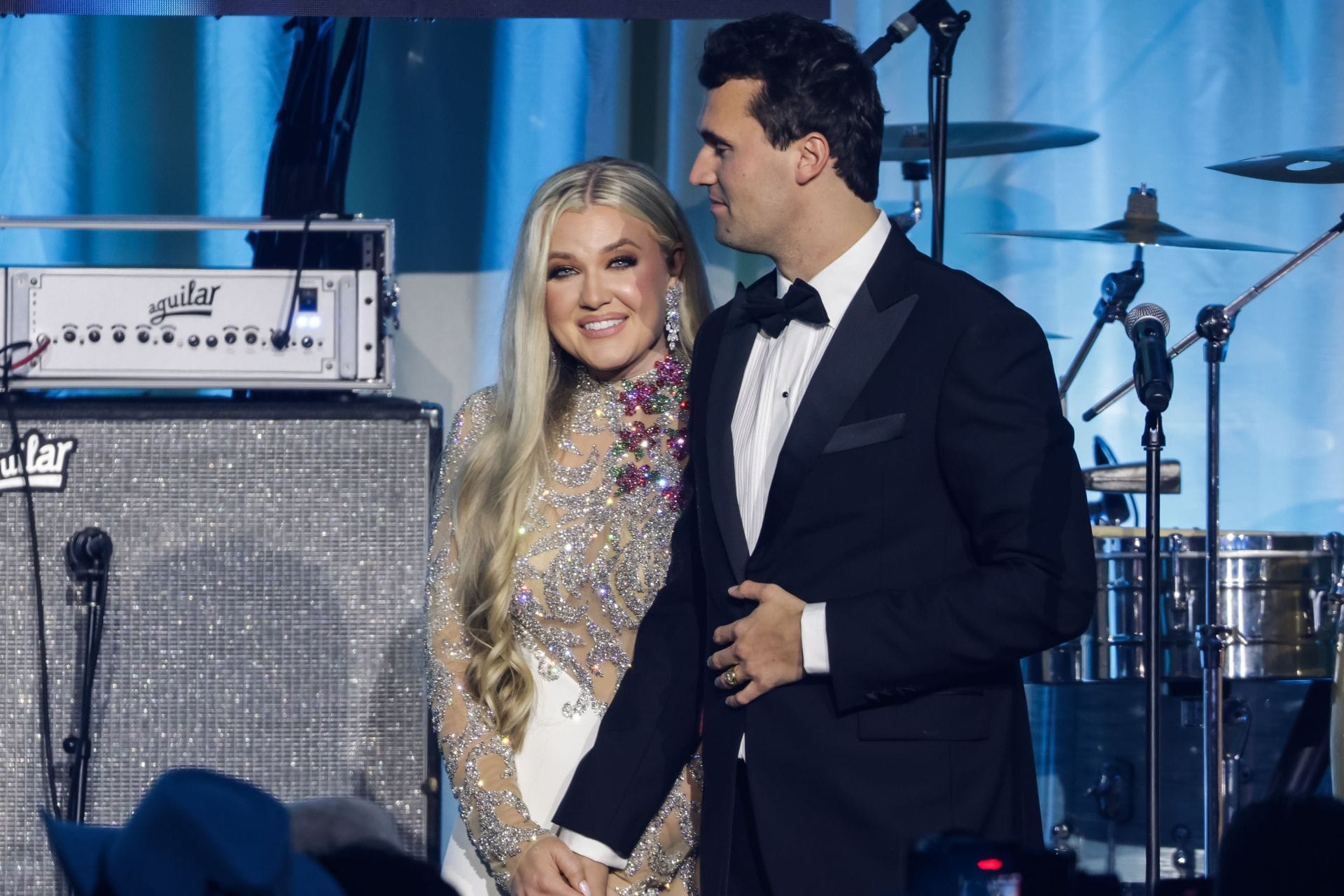 Charlie Kirk and his wife, Erika Kirk, on stage during the Turning Point USA inaugural-eve ball at the Salamander Hotel on January 19, 2025 (Image via Getty)