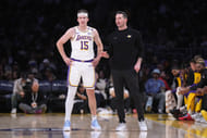 Lakers coach JJ Redick (right) talks with guard Austin Reaves (15) in the first half at Crypto.com Arena. Mandatory credit: Kirby Lee-Image Images