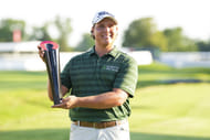 Aldrich Potgieter poses with the trophy after winning the Rocket Mortgage Classic 2025 (Image Source: Imagn)