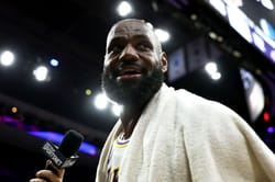 LeBron James Playfully Flexes Wealth as Courtside Fan Mocks His Bald Hairline
