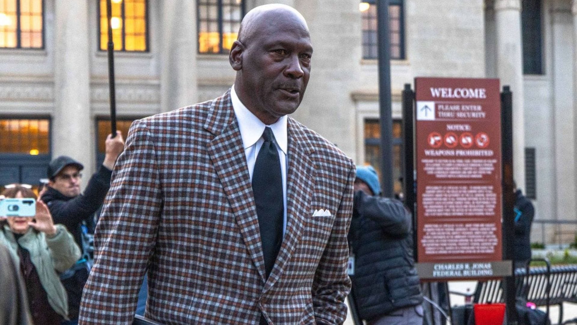 Michael Jordan Breaks Character With Rare Gesture While Exiting Courthouse