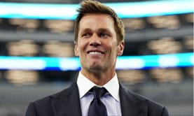 Tom Brady accepts loss on behalf of clone dog Junie as $40,000,000 British actor jokingly flexes his toy poodle