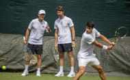 Samuel Lopez (left) and Juan Carlos Ferrero (center) observe Carlos Alcaraz (right) practicing at the 2025 Wimbledon Championships (Source: Getty)
