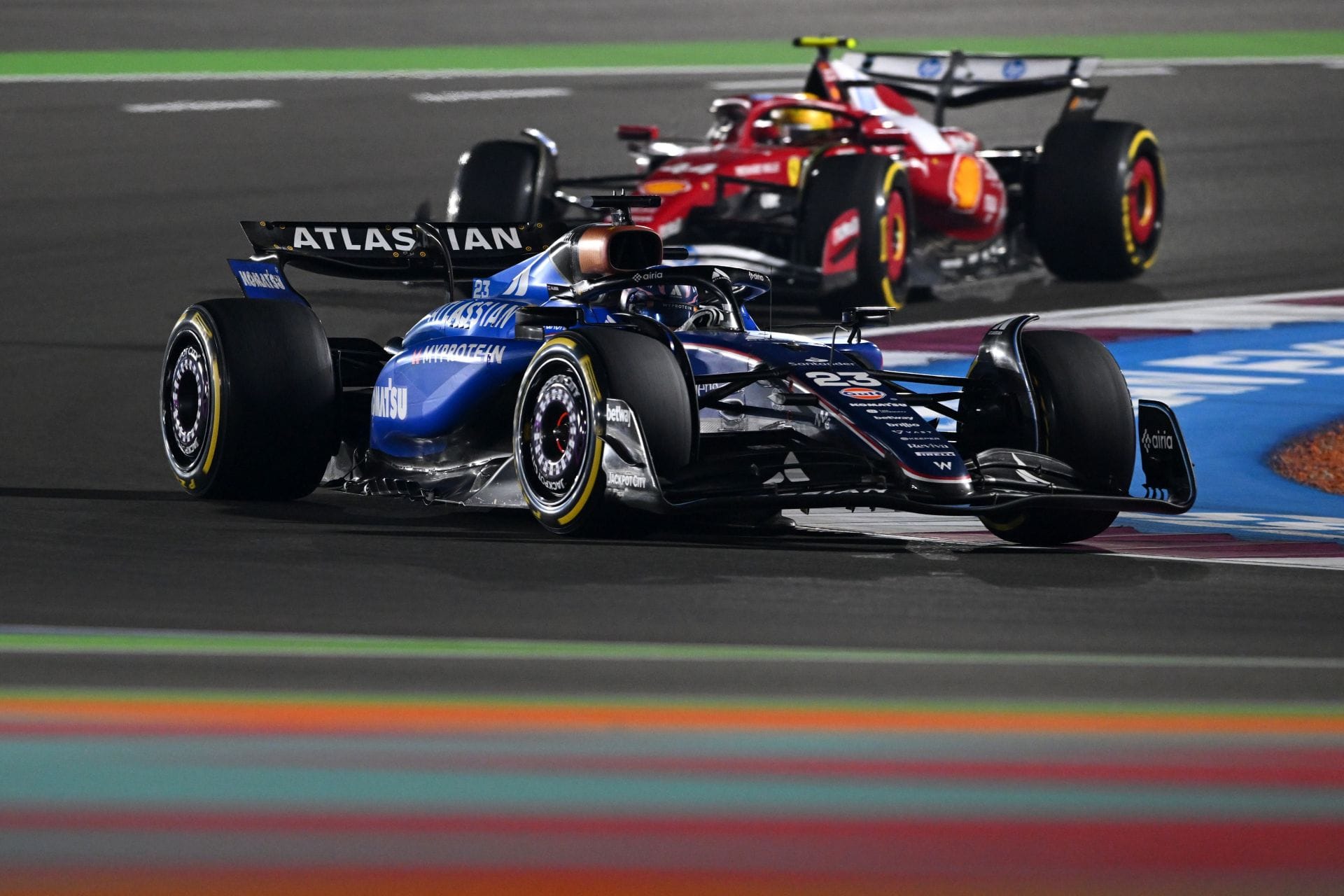 Alex Albon leads Lewis Hamilton at the 2025 F1 Qatar Grand Prix - Source: Getty