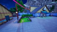 You can find the Fortnite Chapter 7 Season 1 touch grass Easter egg between these buildings in Wonkeeland (Image via Sportskeeda Gaming || Epic Games)