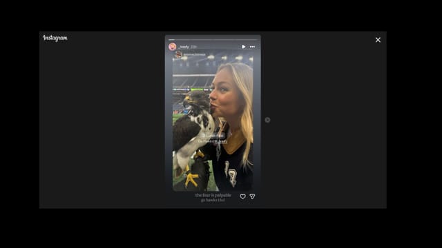 Katie Hoofnagle kissing the seahawk.  (Credit:_hoofy)