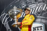 Alex Palou with the 2025 IndyCar championship trophy at the Borchetta Bourbon Music City Grand Prix - Source: Getty
