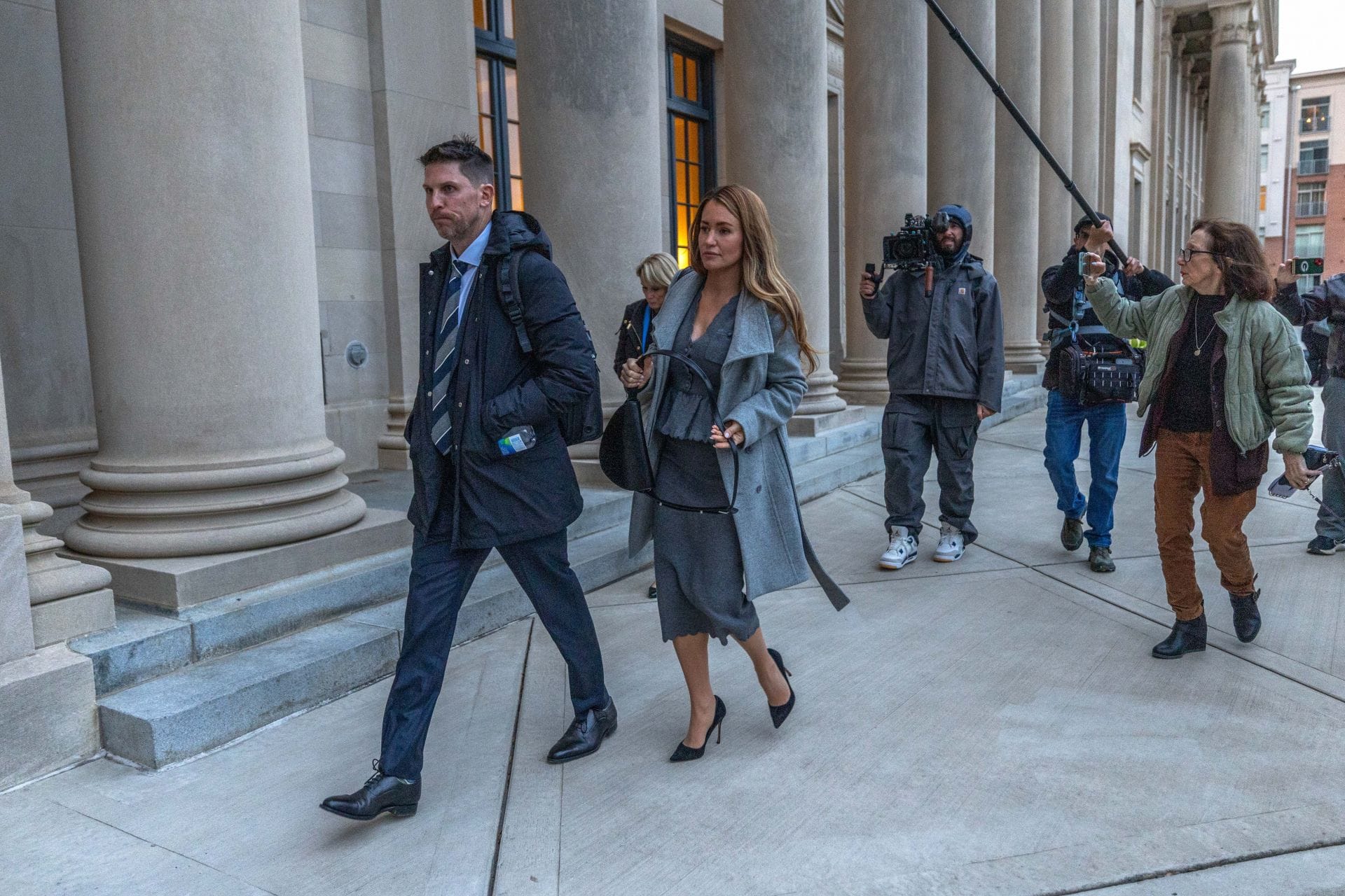 Denny Hamlin (L) and wife Jordan Fish depart the North Carolina Federal courtroom. Source: Getty